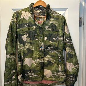 Lightweight, camouflage puffer jacket.  Size small.  Worn once, snap closure.